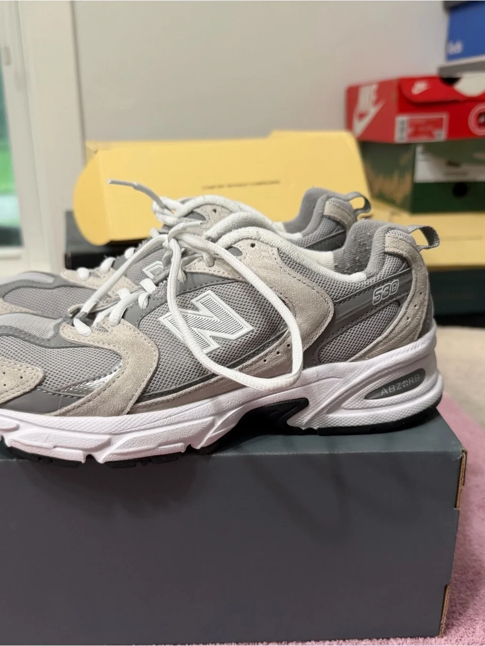 New Balance womens Gray and White Athletic Sneakers